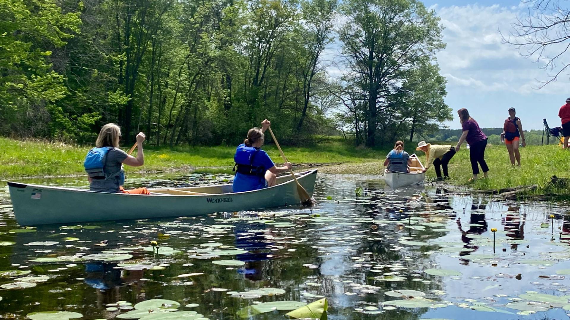 Canoes among lily pads at the Teacher Field School