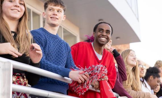 Hamline students looking out at field