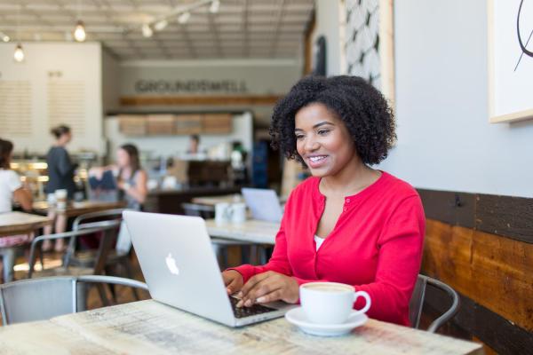 Online bachelor's degree completion student at coffee shop