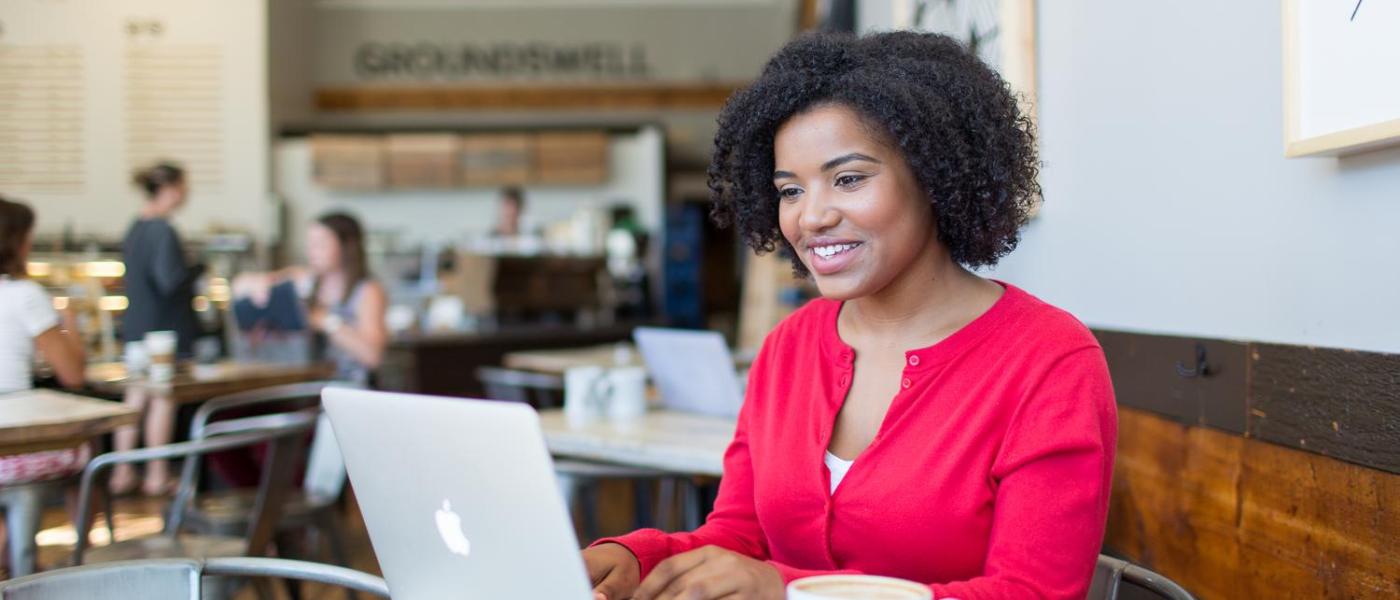 Online bachelor's degree completion student at coffee shop