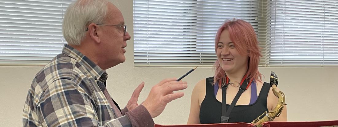 Music lessons, student taking saxophone lessons