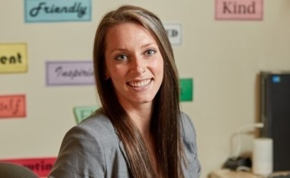 Kate Roselle is looking at the camera and smiling