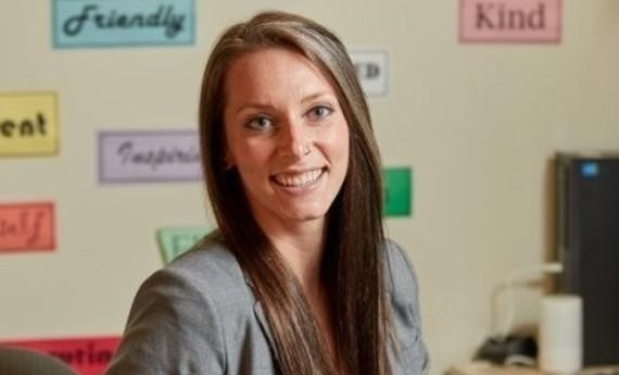 Kate Roselle is looking at the camera and smiling