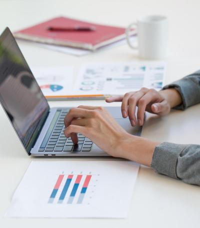 hands typing on laptop computer