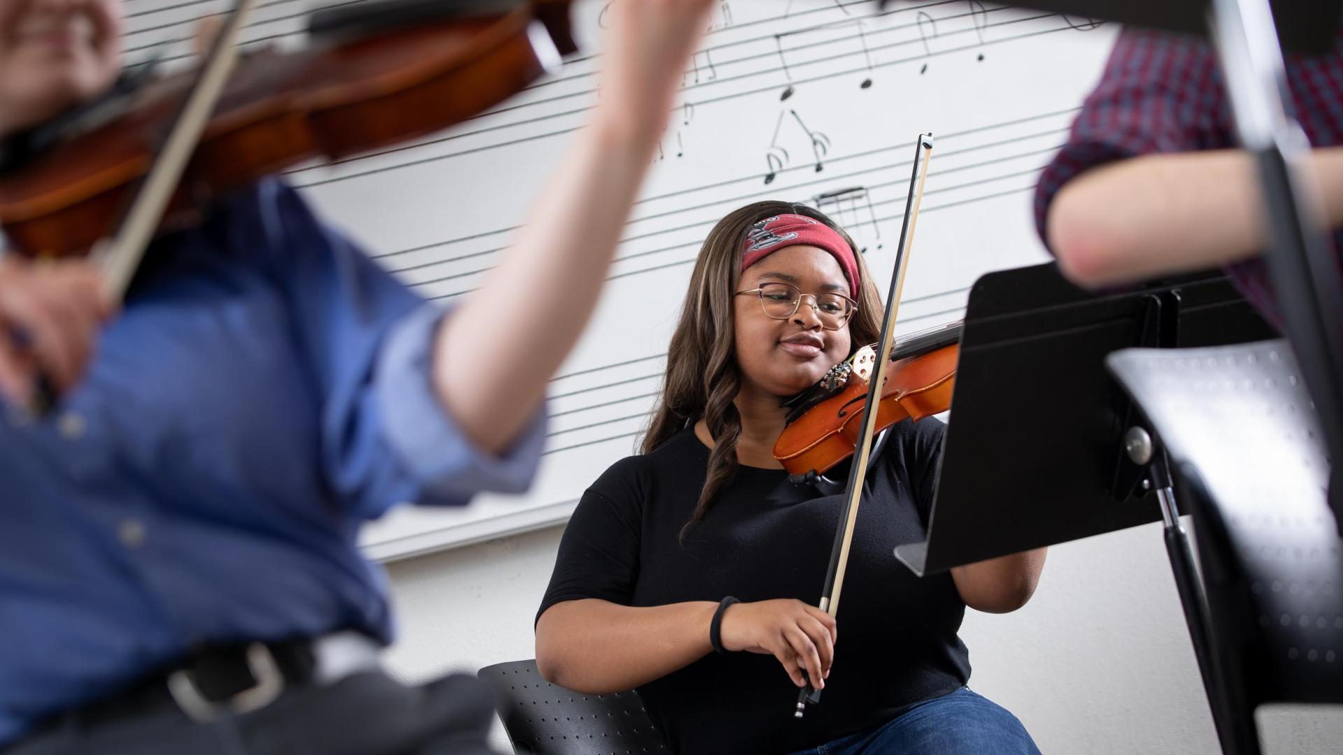 Music student at Hamline playing violin