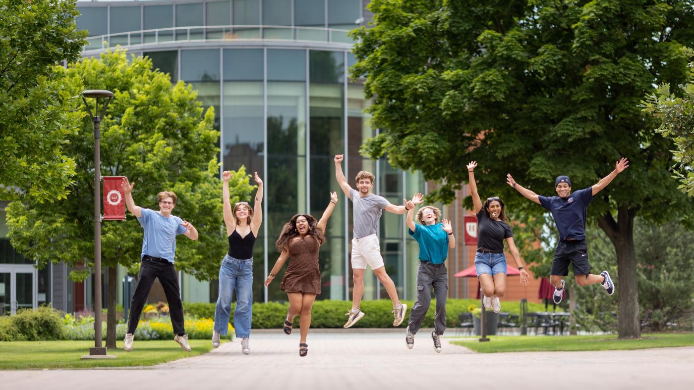 Homepage -- Hamline students jumping in front of Anderson Center