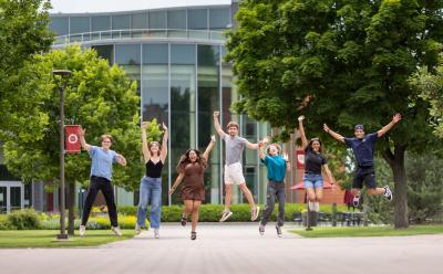 Homepage -- Hamline students jumping in front of Anderson Center